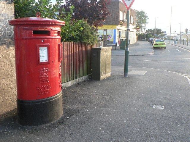 A red postbox on a UK street