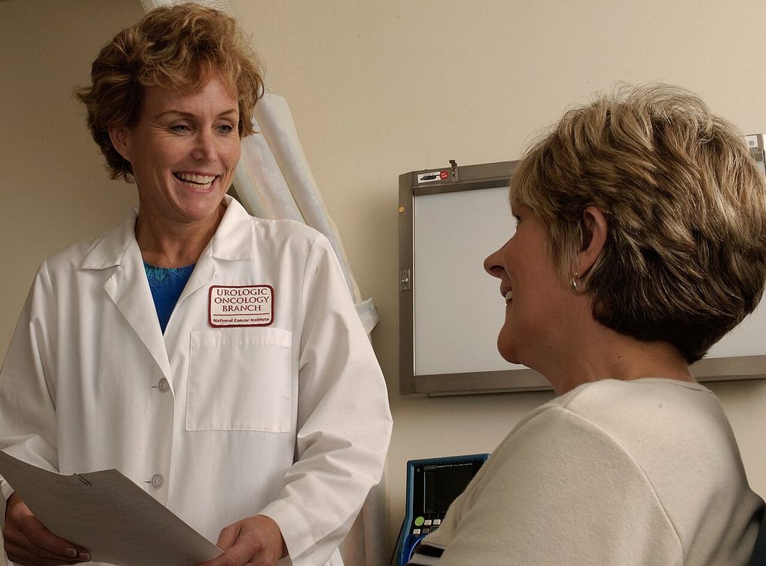 A doctor talking with a patient